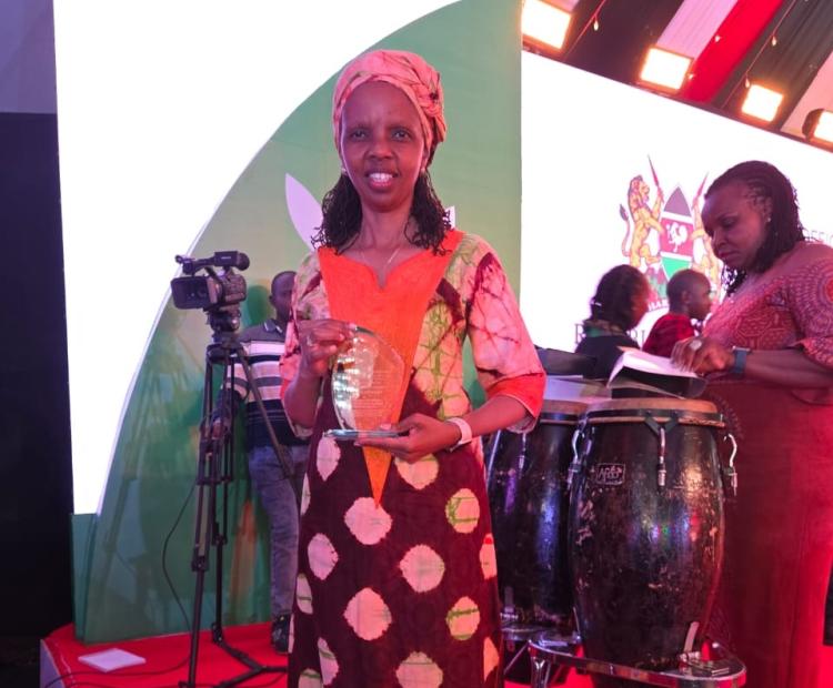 CEO with the award trophy