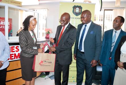 KUCCPS Chief Executive Officer Dr. Agnes Mercy Wahome hands a package to Kenya School of Law (KSL) Director Dr. Henry Mutai after they launched a partnership on February 10, 2025. The partnership is meant to enable applications for Kenya School of Law’s Diploma in Law Course through the KUCCPS portal, during the current course application window. With them are Mr. Gerald Gekombe, KSL’s Paralegal Training Programme Coordinator (3rd left) and Mr. Lawrence Ndirangu, Senior Academic Services Officer at KSL.