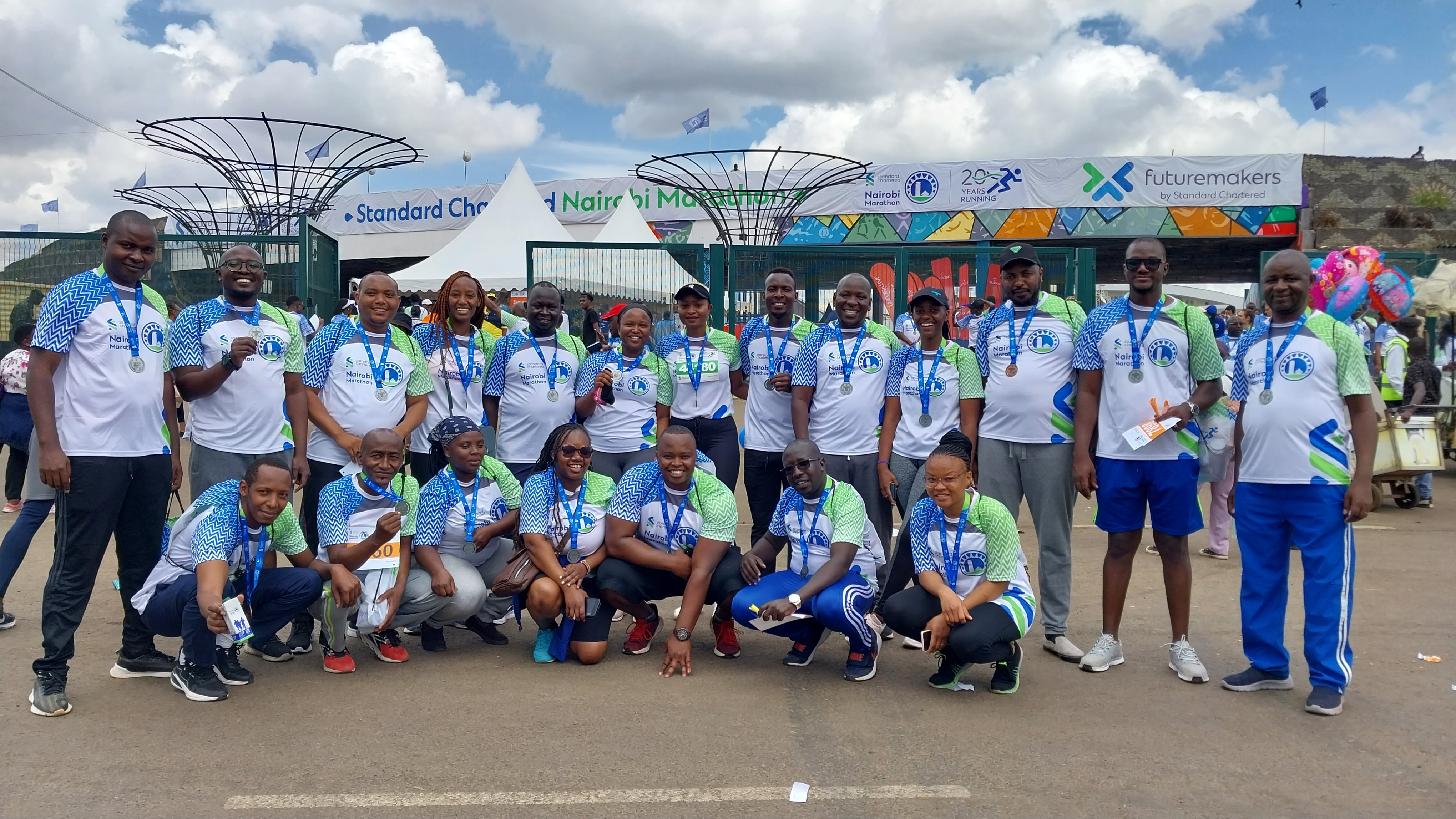 KUCCPS staff taking a group photo at Standard Chartered Marathon