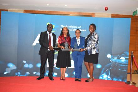 CEO group photo with trophies